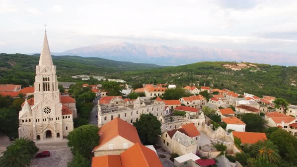 Aerial drone shot of a church in Sumartin Brac Island Croatia
