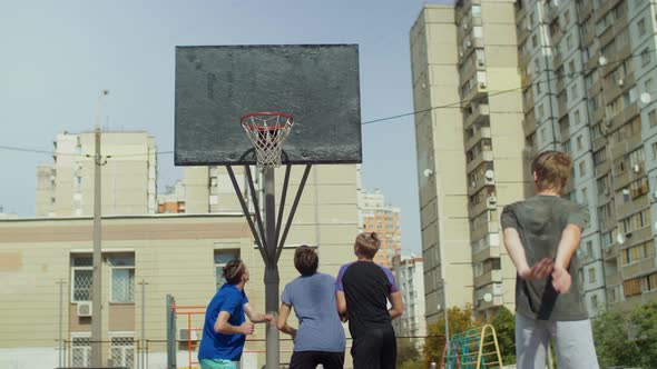 Streetball Players Figthing for Rebound on Court