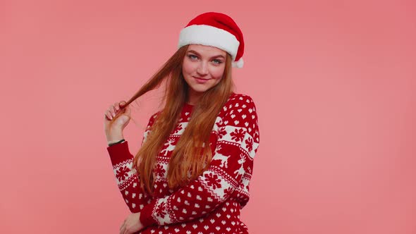 Cheerful Lovely Girl Wears Red Christmas Sweater and Hat Smiling Looking at Camera Happy New Year