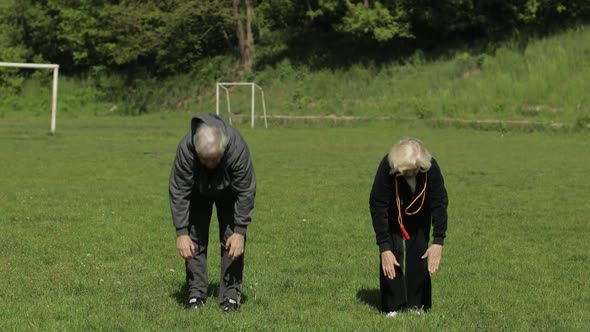 Active Senior Old Couple. Man and Woman Do Stretching Physical Exercises