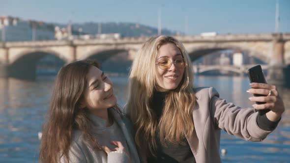 Portrait of Beautiful Friends Smiling on the Phone