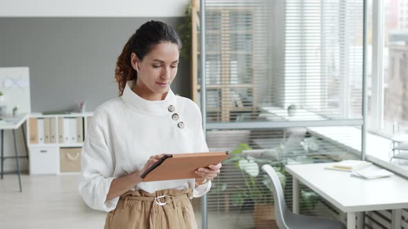 Portrait of Businesswoman Using Gadgets