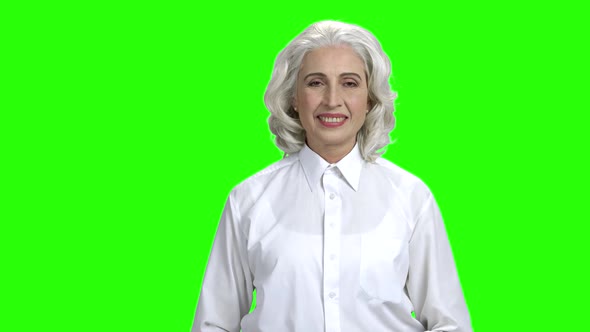 Pretty Senior Woman Giving Thumb Up on Green Screen