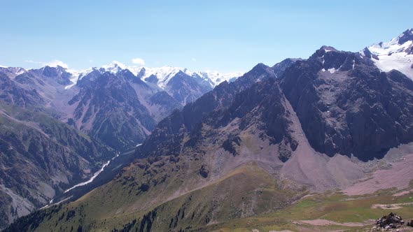 High Mountains Covered with Snow in Places