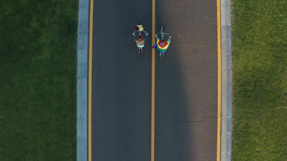 Drone Shot of Gay Couple Biking Along Bicycle Path