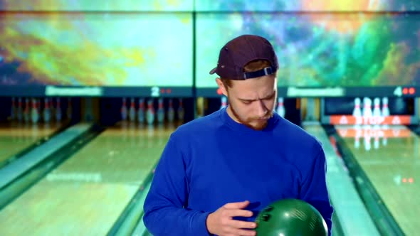 Man Gestures Ok at the Bowling