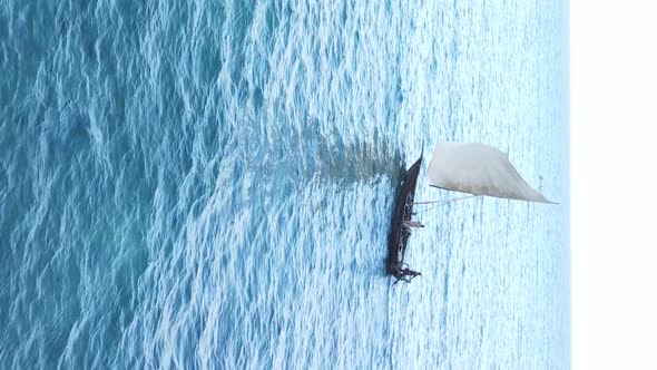 Vertical Video Boats in the Ocean Near the Coast of Zanzibar Tanzania Aerial View