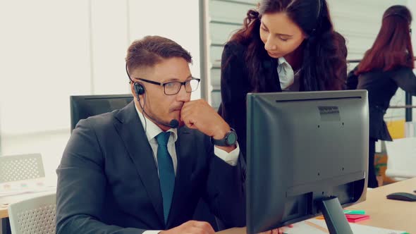 Business People Wearing Headset Working in Office