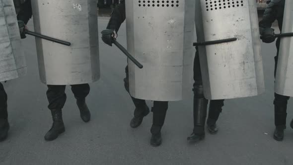 Unrecognizable Riot Policemen with Shields