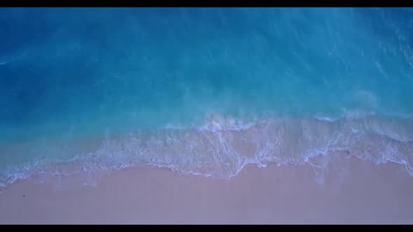 Aerial drone nature of tropical resort beach journey by shallow lagoon with white sandy background o