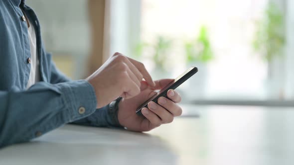 Close Up of Hand Using Smartphone Mobile