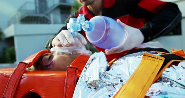 Paramedics examining injured girl