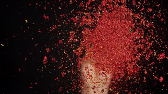 Pouring Paprika on Glass on Black Background Using Seasoning and Flavors