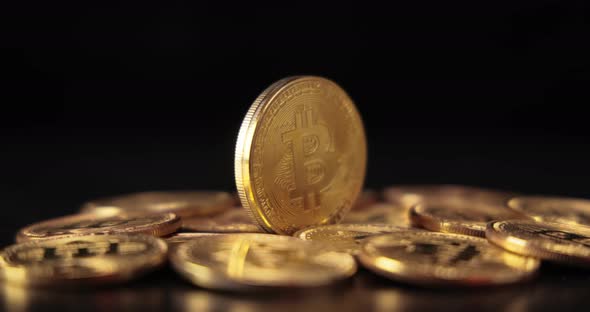 Gold Bit Coin BTC Cryptocurrency Coins on a Black Background