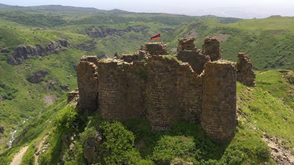 Armenian Flag Waving on the Ancient Hill Fortress Amberd in Armenia