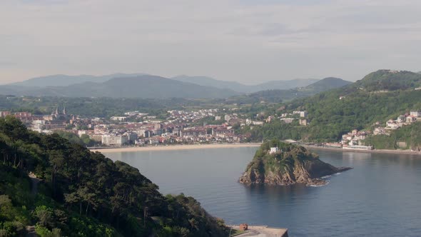 Beautiful hilly landscape and city of San Sebastian, aerial drone view