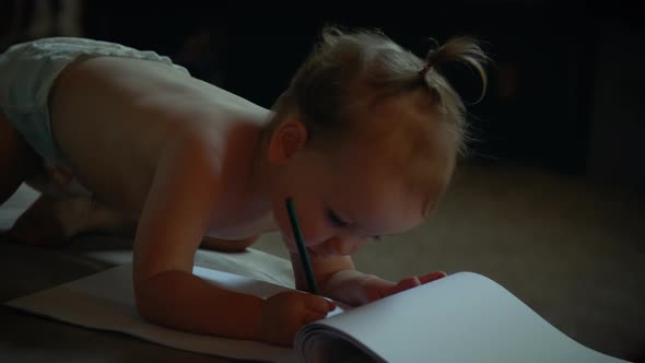 Baby Drawing In Living Room Wearing Diaper alt