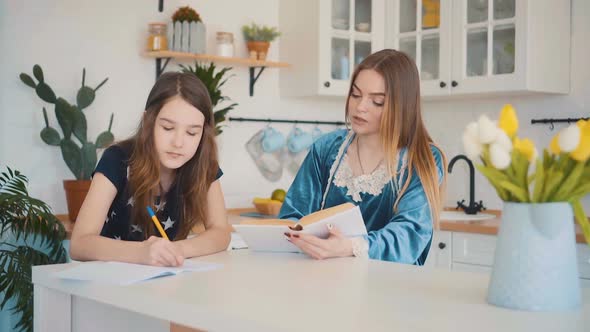 Mom and Daughter do Homework