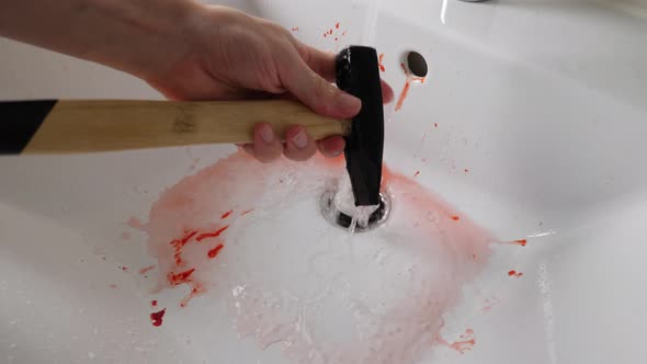 A Bloody Murder Weapon being Washed by Serial Killer, 4K, Fake Blood