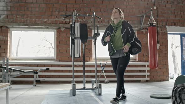 Female Athlete Going to Train in Gym