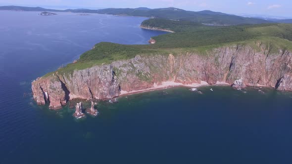 View From a Drone of the Coastline with a Rocky Coast Island of Shkot