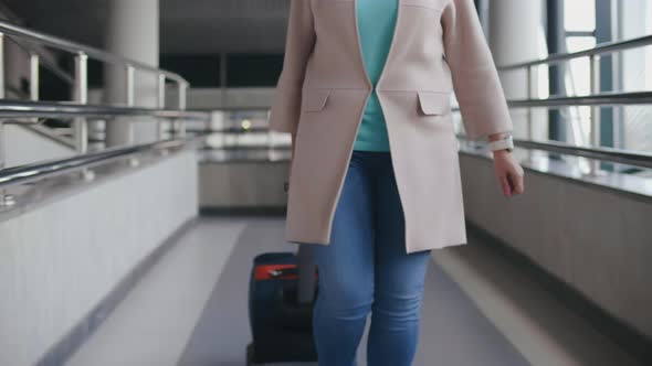 Aged Lady Running and Dragging Suitcase Being Late for Train or Flight