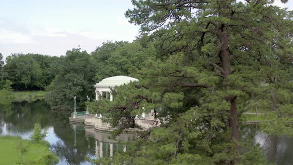 Bandstand Structure By The Lake Surrounded With Green Trees At Roger Williams Park In Providence, Rh