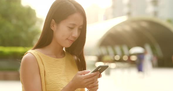 Woman Use of Mobile Phone in City