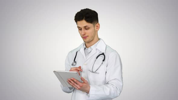 Doctor Holding Digital Tablet Pc and Reading Results on Gradient Background.