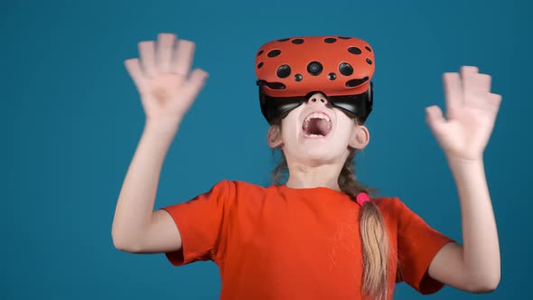 Girl with Modern VR Headset Scared By Virtual Game