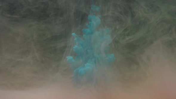 Slow Motion Turquoise Blue Ink Drops in Water with Colored Paint and Mixes