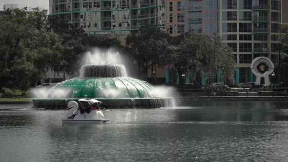 Swan boat and the springing fountain in Lake Eola