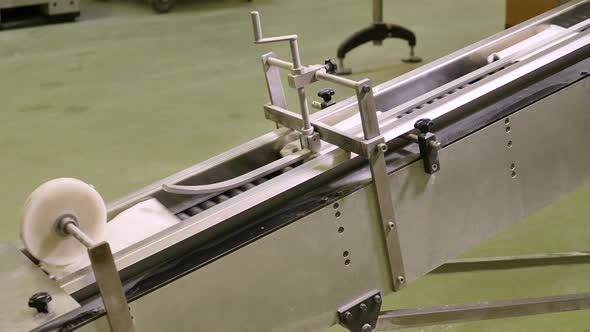 Bags with cooking flower on production line in bakery factory