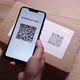 Scanning QR Code on Cardboard Parcel Using Cell Phone Indoor at Apartment - VideoHive Item for Sale