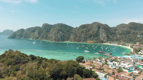 Reveal of Ton Sai Beach encircled by enchanting Ko Phi Phi Don Island Landscape, Thailand