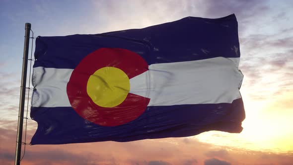 Flag of Colorado Waving in the Wind Against Deep Beautiful Sky at Sunset