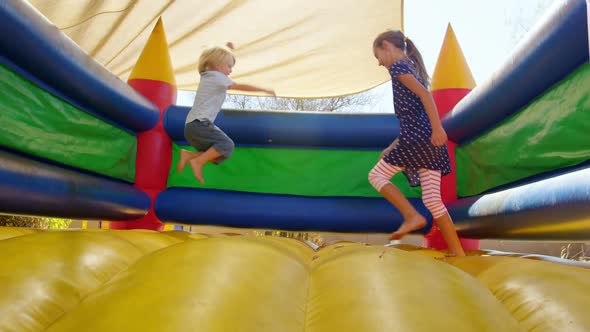 Kids playing on the bouncing castle