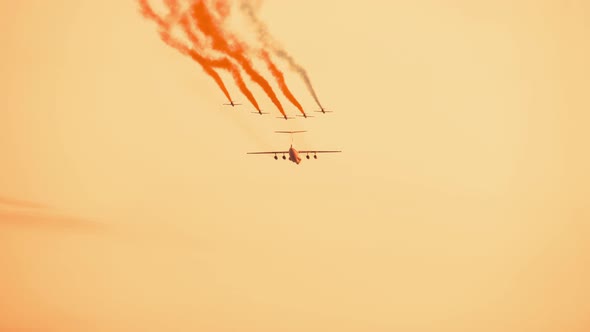 Armed Russian Fighter Jets with Smoke Trail on the Red Sunset Background