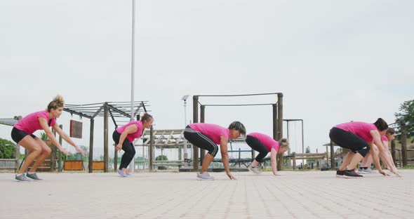 Female friends enjoying exercising at boot camp together