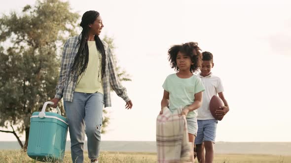 A beautiful family is going to have a picnic time