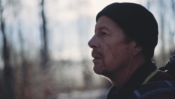 Man In Hat Looking Away In Cold Winter