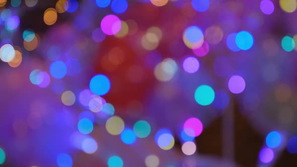Shimmering abstract colored circles defocused christmas lights video. Blurred fairy lights. 