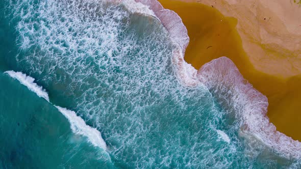 Aerial view of drone. Scene of top view beach and crystal seawater on sandy beach in summer