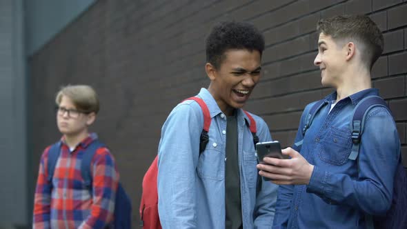 Two Bully Boys Posting Offensive Video About Upset Guy Behind, Cyberbullying