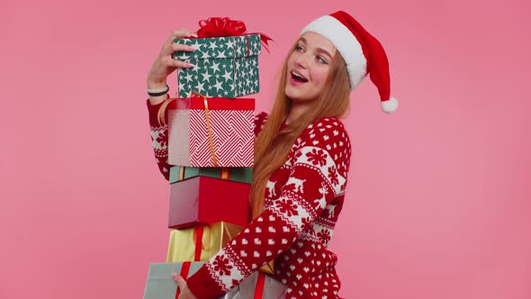 Girl in Christmas Red Sweater Santa Hat Smiling Holding Many Gift Boxes New Year Presents Shopping