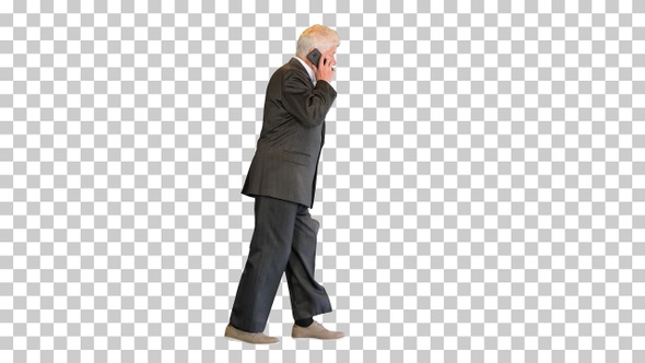 Senior businessman walking and making a call, Alpha Channel