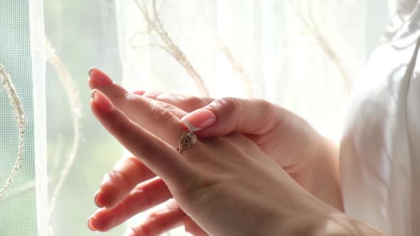 Close Up on the Hand of the Bride Wedding Ring