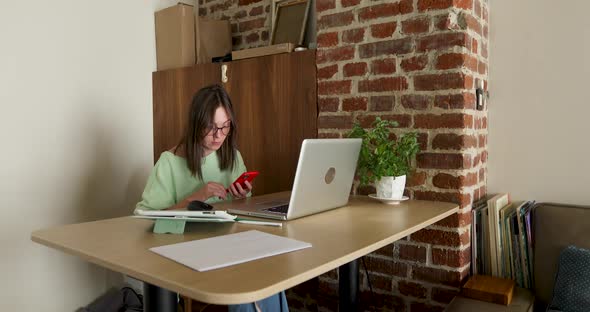 Woman Working at Home Using Laptop