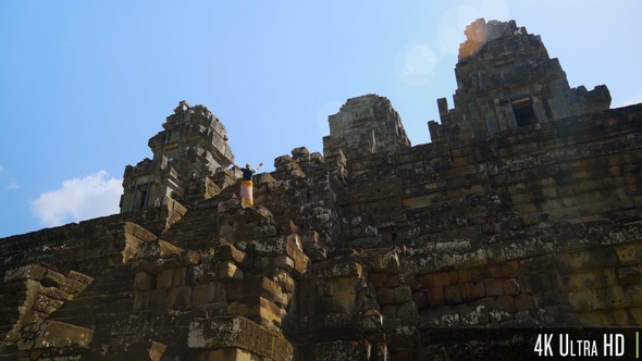 4K Excited Woman on Ta Keo Temple Stairs in Siem Reap, Cambodia