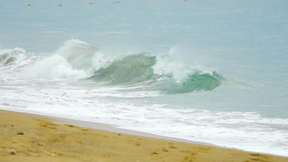 Powerful Wave Breaks Along the Shore